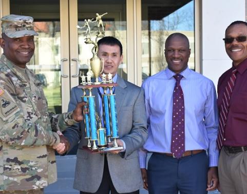 Men holding trophy