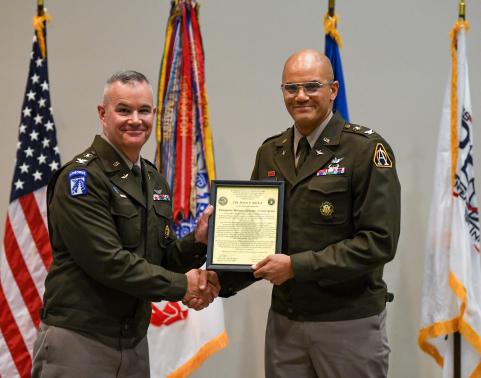 Col. Melvin Mitchell receives the EBS-C charter from Col.(P) RJ Mikesh.