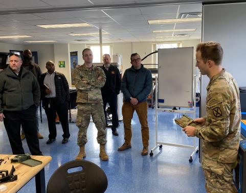 ATIS team members listen to 1LT Cameron Tomczyk from the 10th Mountain Division during the ATIS Software Preview, Nov. 14 at Fort Drum, NY.